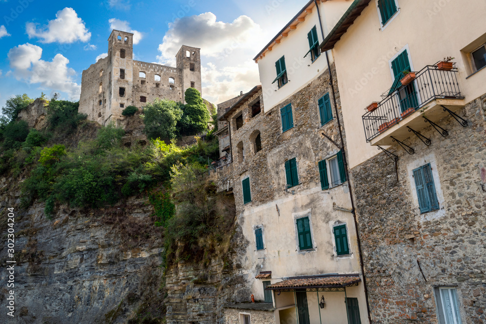 The ancient hilltop castle above the medieval stone village in the Ligurian section of Italy at Dolceacqua.