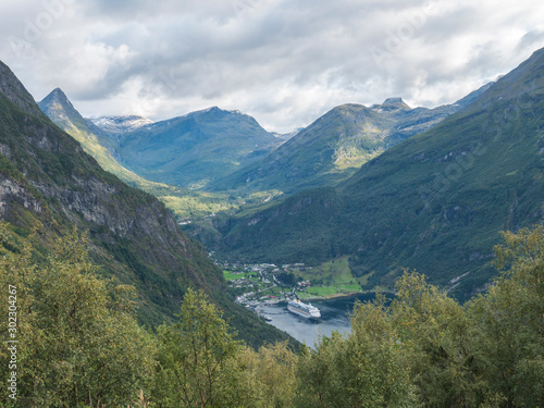View on Geirangerfjord in Sunnmore region, Norway, one of the most beautiful fjords in the world, included on the UNESCO World Heritage. View from Ornesvingen eagle road viewpoint, early autumn