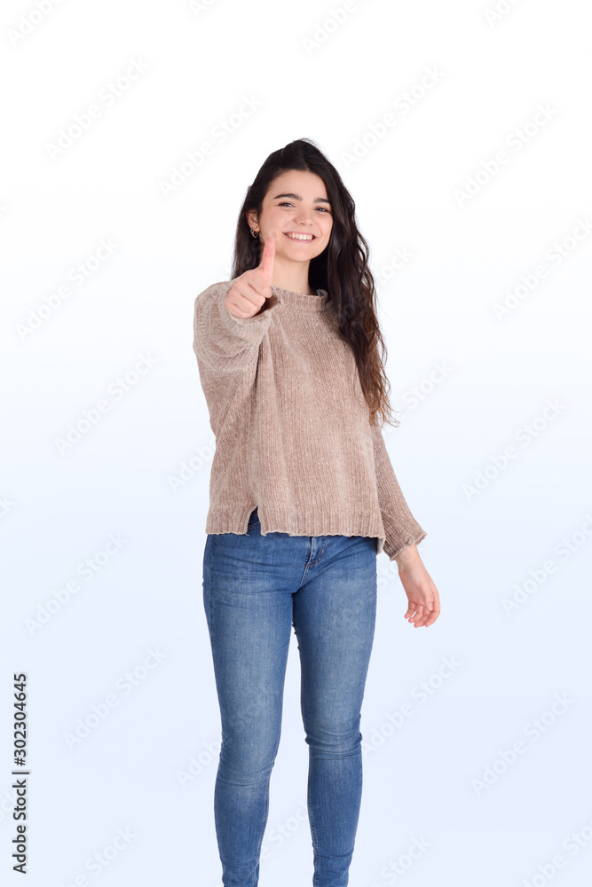 Young woman with thumbs up. Young woman with thumbs up.