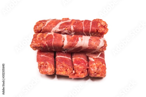 Chevapchichi in bacon isolated on white background.