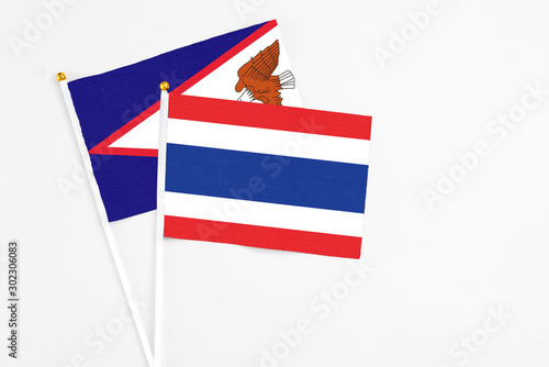 Thailand and American Samoa stick flags on white background. High quality fabric, miniature national flag. Peaceful global concept.White floor for copy space. Free Download Thailand and American Samoa stick flags on white background. High quality fabric, miniature national flag. Peaceful global concept.White floor for copy space. - GFXLoad
