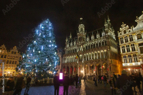 Awe scene of Town Hall Square in Brussel . Illuminated Christmas tree.