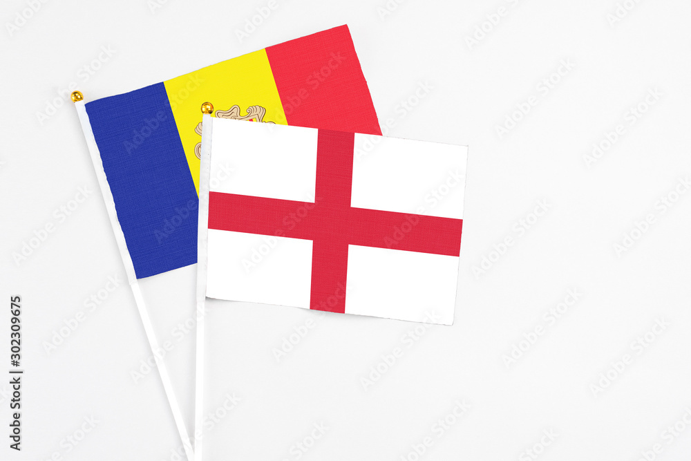 England and Andorra stick flags on white background. High quality fabric, miniature national flag. Peaceful global concept.White floor for copy space.