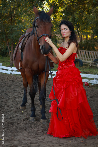 Beautiful young woman with horse outdoors © Mynameislisenok