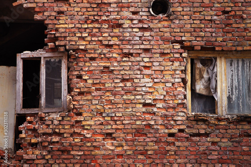 Old broken windows on brick wall