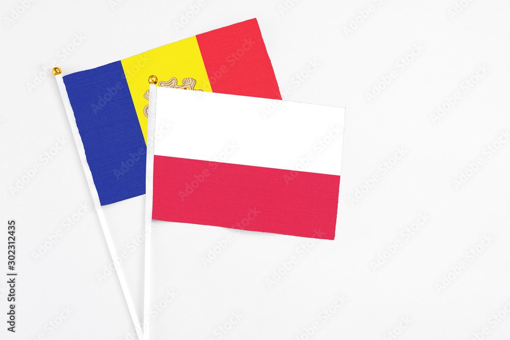 Poland and Andorra stick flags on white background. High quality fabric, miniature national flag. Peaceful global concept.White floor for copy space. Poland and Andorra stick flags on white background. High quality fabric, miniature national flag. Peaceful global concept.White floor for copy space.