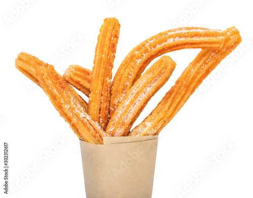 Churro stick in apaper bag.  Churro - Fried dough pastry with sugar powder isolated on a white background.  Close up photo