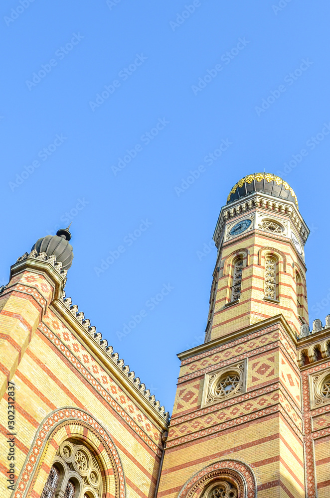 Vertical photo of the Great Synagogue in Budapest, Hungary. Known also as Dohany Street Synagogue, the largest synagogue in Europe. Centre of Neolog Judaism. Ornamental facade and a onion dome