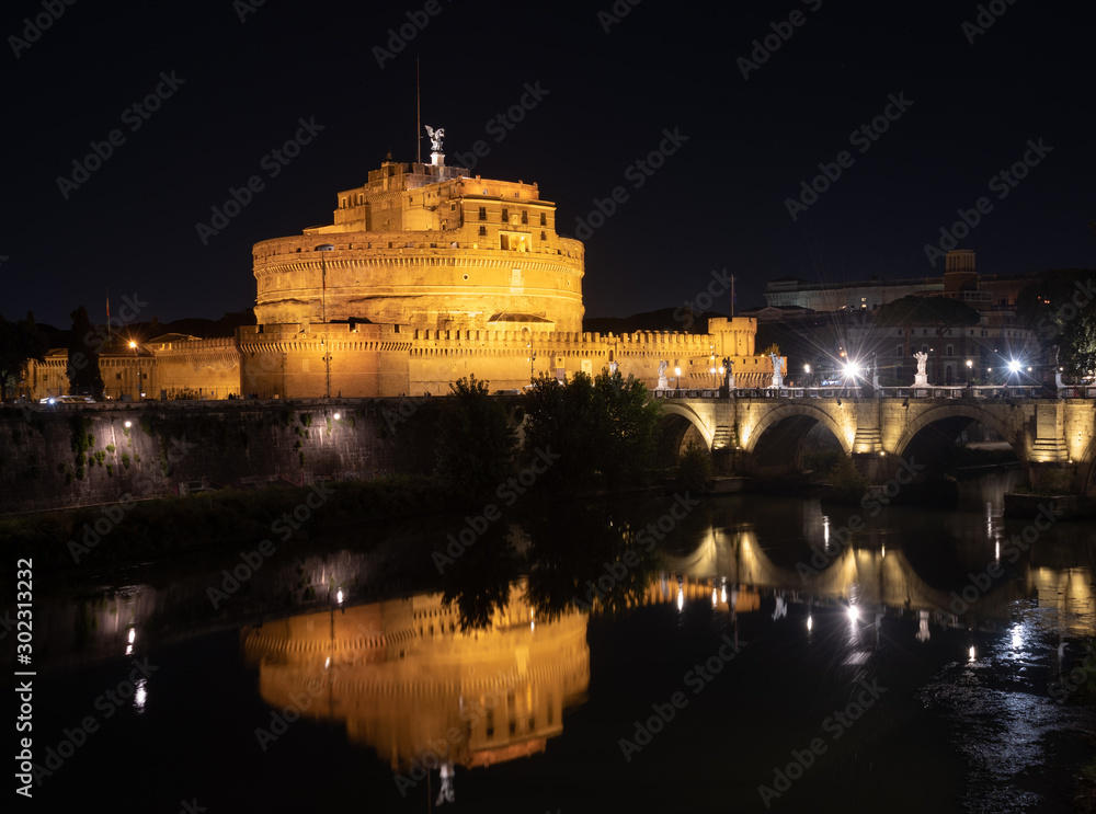 Saint Angel Castle and Bridge, Rome, Italy. Night, long exposure. Reflection in Tiber river. 