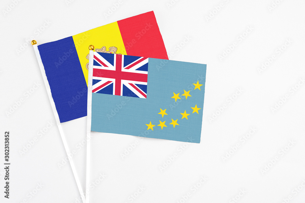 Tuvalu and Andorra stick flags on white background. High quality fabric, miniature national flag. Peaceful global concept.White floor for copy space. Tuvalu and Andorra stick flags on white background. High quality fabric, miniature national flag. Peaceful global concept.White floor for copy space.
