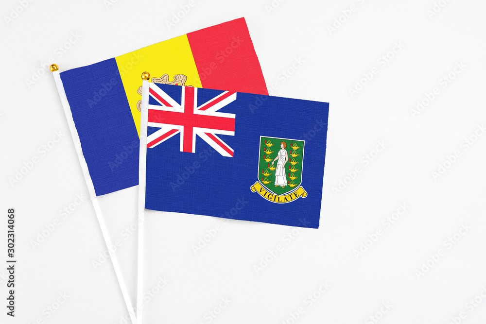 Fototapeta premium British Virgin Islands and Andorra stick flags on white background. High quality fabric, miniature national flag. Peaceful global concept.White floor for copy space.