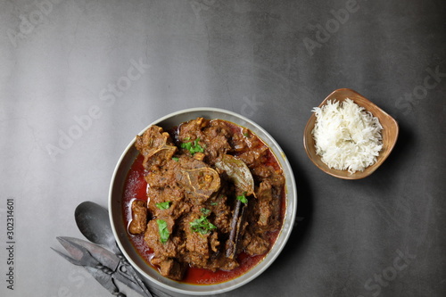 Overhead view of Indian  Goat curry, Mutton curry, Nihari, Rogan Josh in a bowl . photo