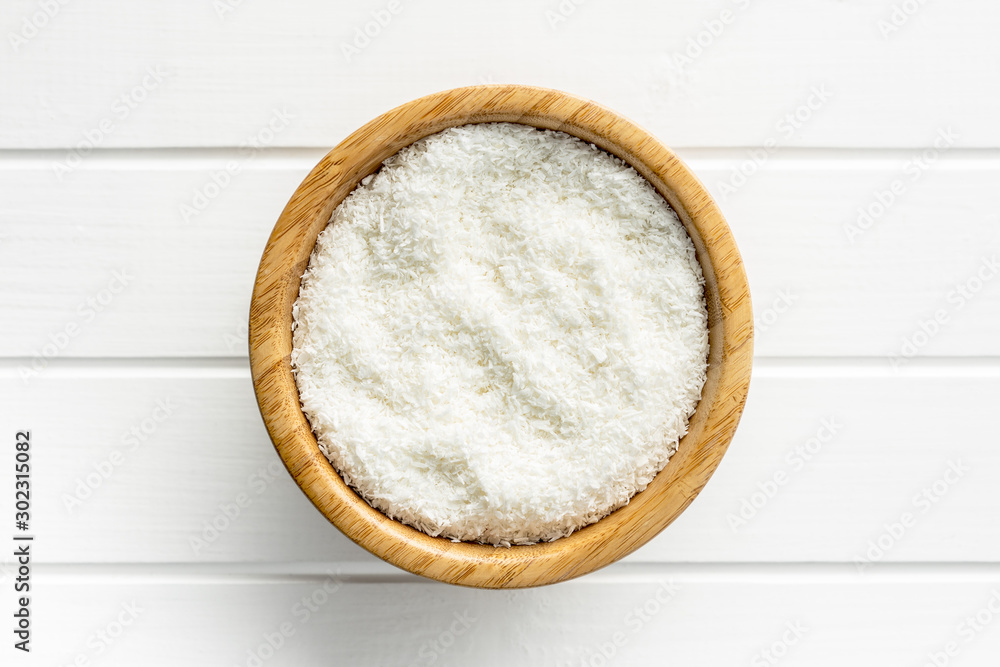 Grated coconut in bowl. Grated coconut in bowl.