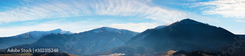 panorama of mountains with snow capped tops above the rural valley. wonderful weather condition of november. borzhava ridge with Velykyy Verkh  Play and Temnatyk peaks