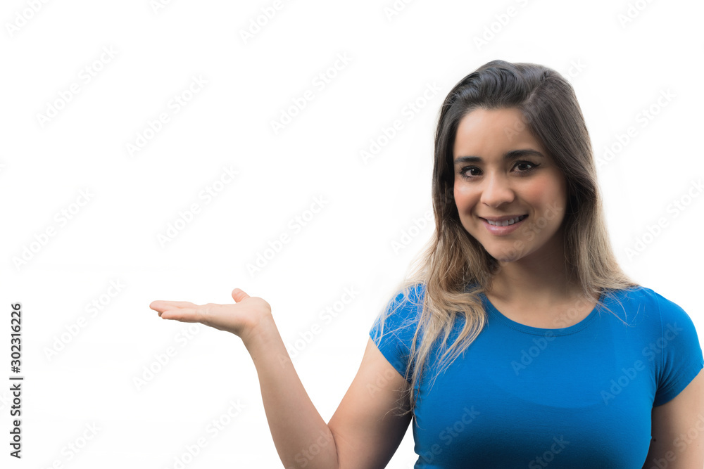 Isolated young woman showing her hand palm up. Smiling woman showing product Isolated young woman showing her hand palm up. Smiling woman showing product