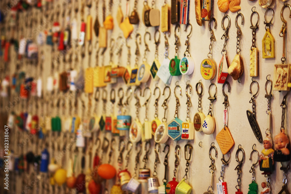 many vintage key rings hanging from a party in a Paris market, France
