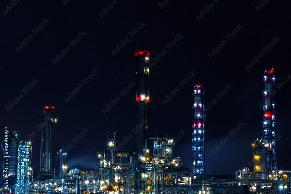 Night shot of oil refinery plant of Petrochemistry industry in twilight time.