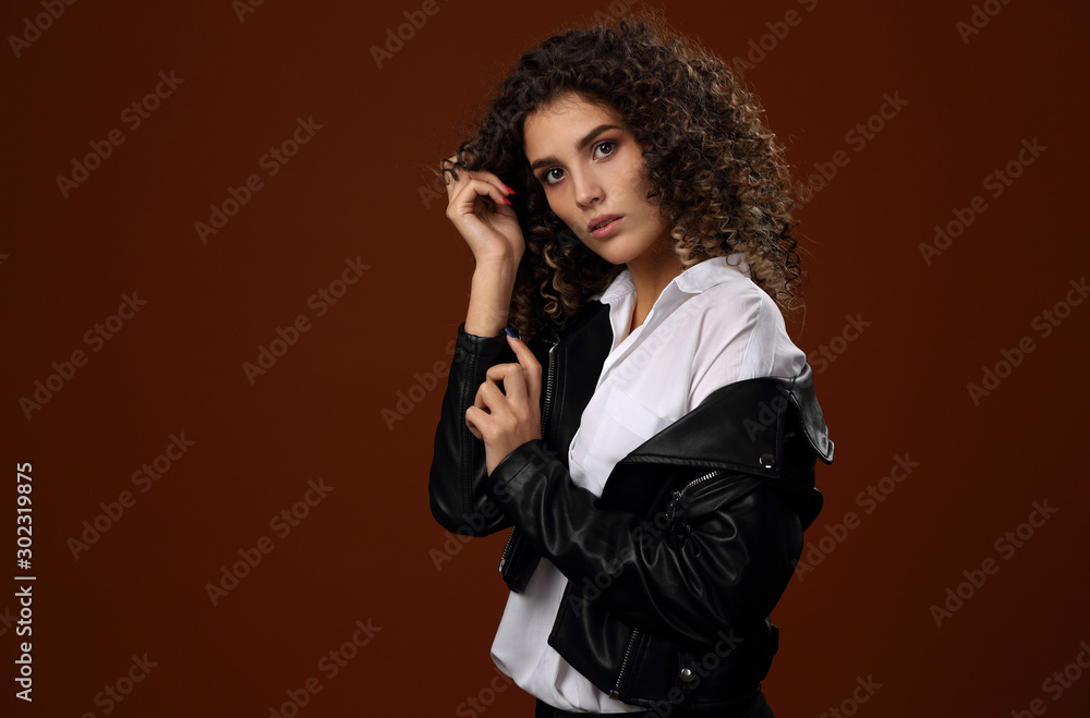 Beautiful girl in white blouse and black leather jacket Beautiful girl in white blouse and black leather jacket