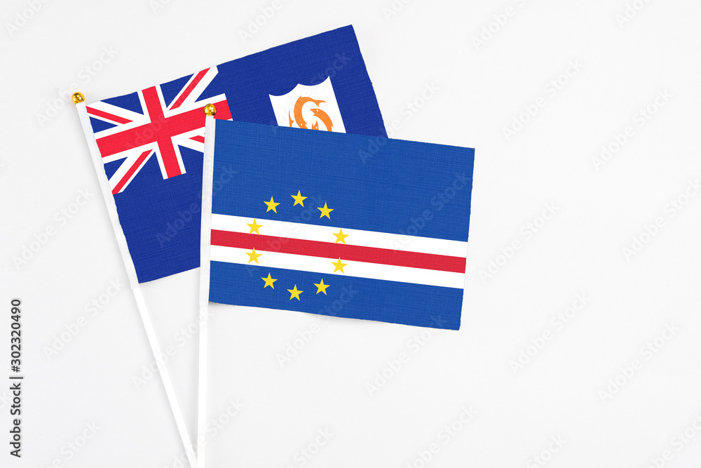 Cape Verde and Anguilla stick flags on white background. High quality fabric, miniature national flag. Peaceful global concept.White floor for copy space. Cape Verde and Anguilla stick flags on white background. High quality fabric, miniature national flag. Peaceful global concept.White floor for copy space.