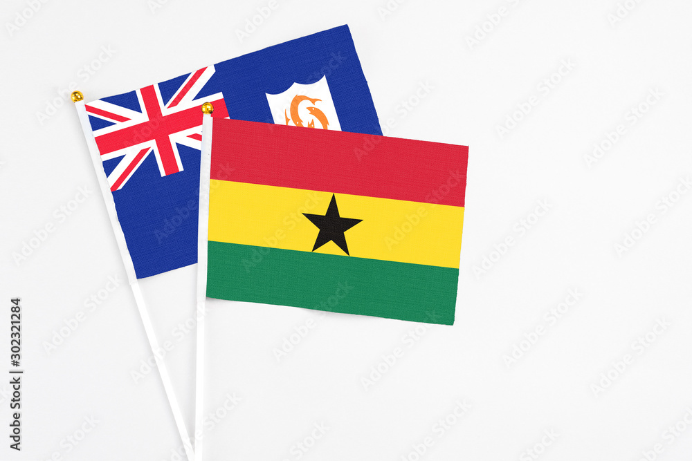 Ghana and Anguilla stick flags on white background. High quality fabric, miniature national flag. Peaceful global concept.White floor for copy space. Ghana and Anguilla stick flags on white background. High quality fabric, miniature national flag. Peaceful global concept.White floor for copy space.