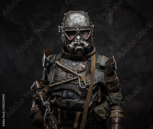 Fotografie Unusual costume for Halloween - dark apocalypse warrior in metal gas mask