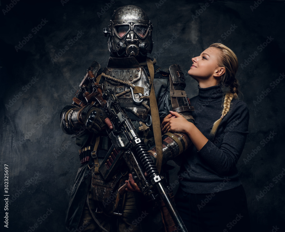 Happy smiling woman is posing for photographer with dark apocalypse warrior. Happy smiling woman is posing for photographer with dark apocalypse warrior.