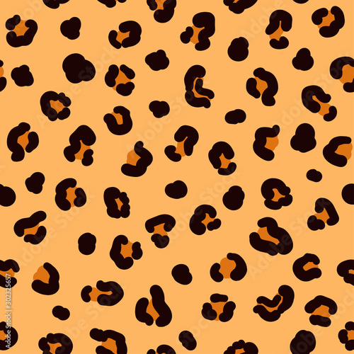 The seamless leopard pattern with dark spots. Vector.