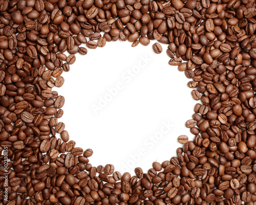 Flat lay photo of coffe beans pile with circular white empty space in the middle