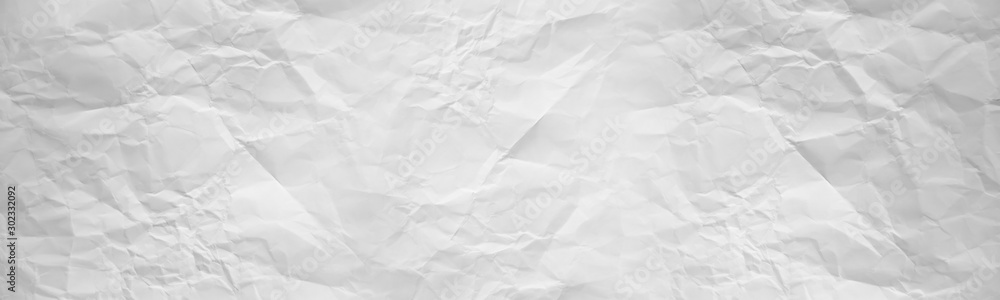 wide panorama crumpled paper texture background. crush paper so that it becomes creased and wrinkled. wide panorama crumpled paper texture background. crush paper so that it becomes creased and wrinkled.