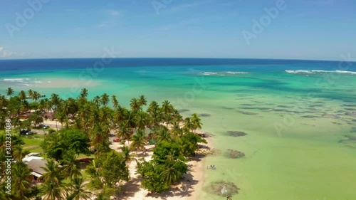 Aerial view of the French Polynesia and Raivavae island with sandy beaches, coral reef and green islets in azure turquoise blue lagoon. Tubuai Islands (Austral Islands), Oceania. and Tahiti. photo