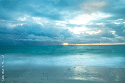 Storm coming at sunrise Isla Blanca Canc  n Mexico
