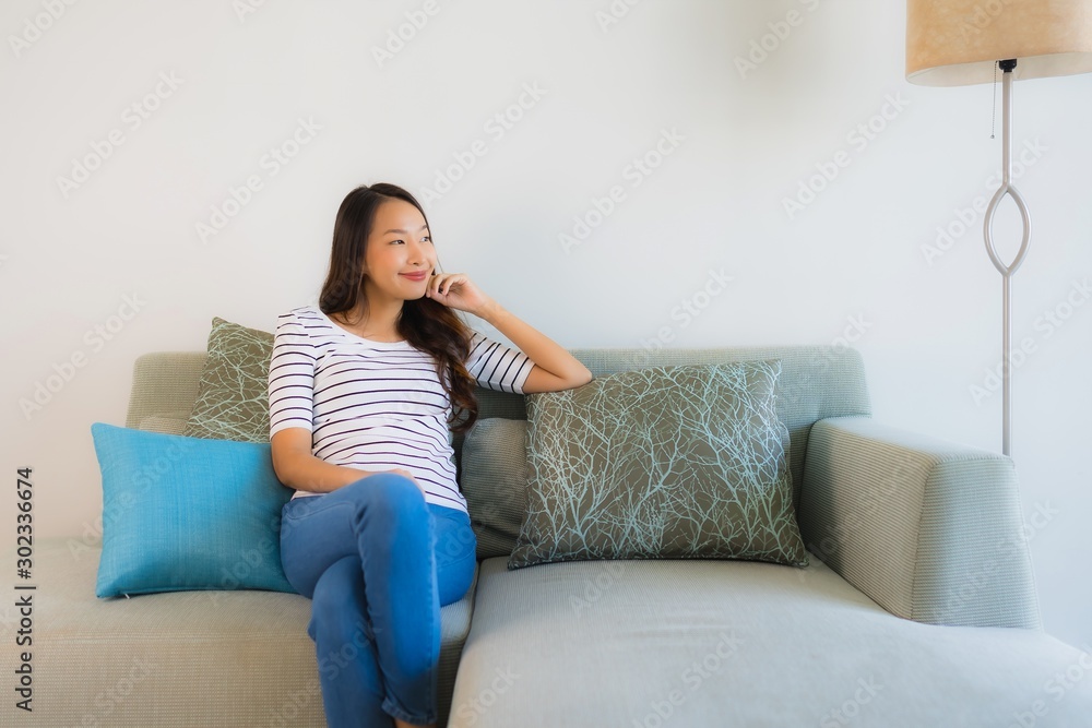 Portrait beautiful young asian woman smile happy on sofa Portrait beautiful young asian woman smile happy on sofa
