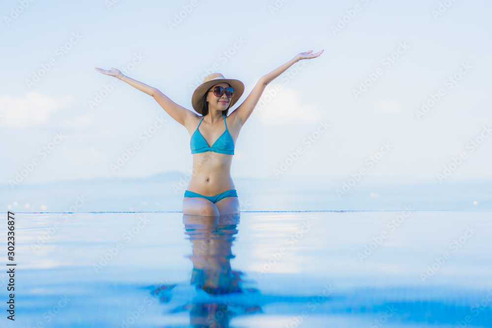 Portrait beautiful young asian women happy smile relax outdoor swimming pool in resort Portrait beautiful young asian women happy smile relax outdoor swimming pool in resort