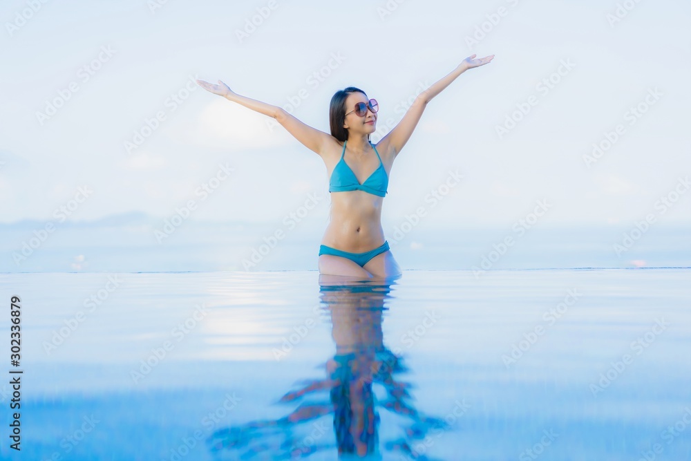 Portrait beautiful young asian women happy smile relax outdoor swimming pool in resort Portrait beautiful young asian women happy smile relax outdoor swimming pool in resort
