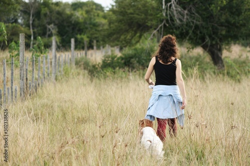 Girl walks on the field with her shaggy friends © SilviaCZaninovich