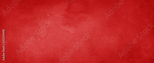 Red background with texture and distressed vintage grunge and watercolor pain...