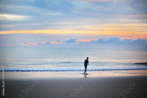 man running on beach