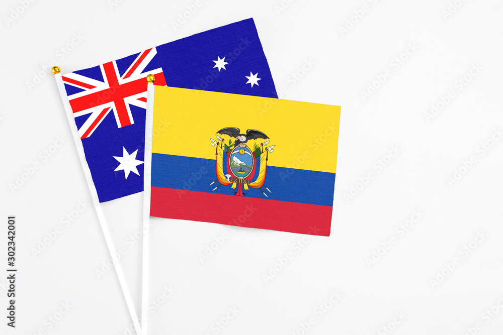 Ecuador and Australia stick flags on white background. High quality fabric, miniature national flag. Peaceful global concept.White floor for copy space.