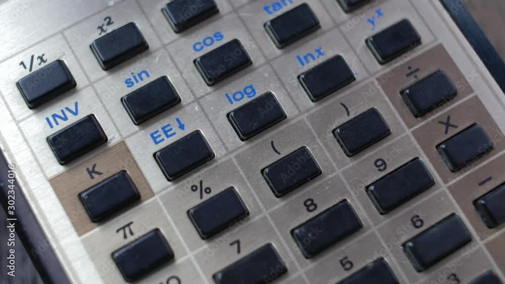 Accountant Using Retro Calculator Pencil Close-up Accountant Using Retro Calculator Pencil Close-up