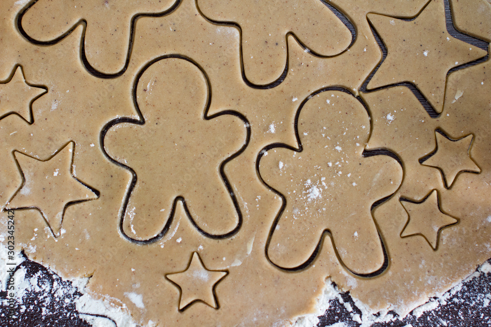 making christmas gingerbread cookies in a kitchen