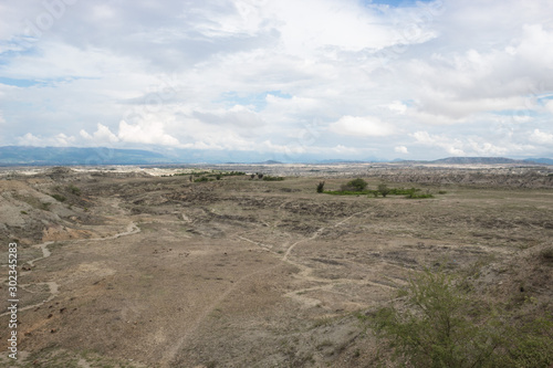 Los Hoyos Landscape with some trekking roads  mountains  and clouds background at Tatacoa Desert  Huila  