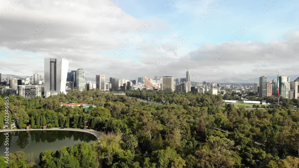 Aerial view of Chapultepec Forest and Polanco neighborhood while drone slowly flies backwards Aerial view of Chapultepec Forest and Polanco neighborhood while drone slowly flies backwards