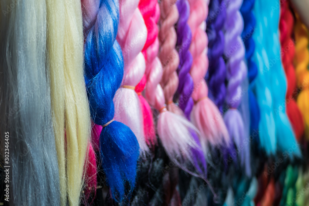 Close-up view of the colorful artificial braiding hairs - obrazy, fototapety, plakaty 