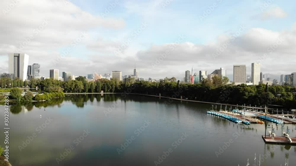Aerial view of Chapultepec Lake in Mexico City. Drone slowly ascending during sunrise. Aerial view of Chapultepec Lake in Mexico City. Drone slowly ascending during sunrise.
