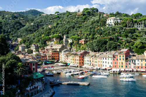 Sea bay with beautiful picturesque village called Portofino. Small marina port at the foot of mountain with a beautiful colourful houses village © kuzenkova