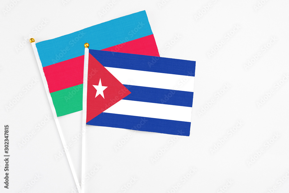 Cuba and Azerbaijan stick flags on white background. High quality fabric, miniature national flag. Peaceful global concept.White floor for copy space. Cuba and Azerbaijan stick flags on white background. High quality fabric, miniature national flag. Peaceful global concept.White floor for copy space.