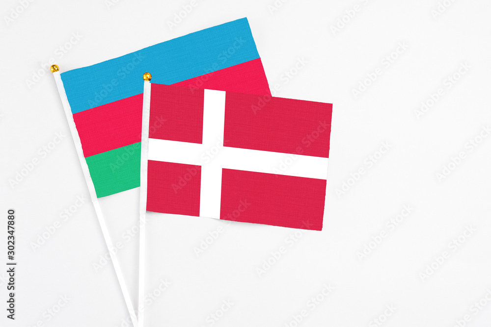 Denmark and Azerbaijan stick flags on white background. High quality fabric, miniature national flag. Peaceful global concept.White floor for copy space.