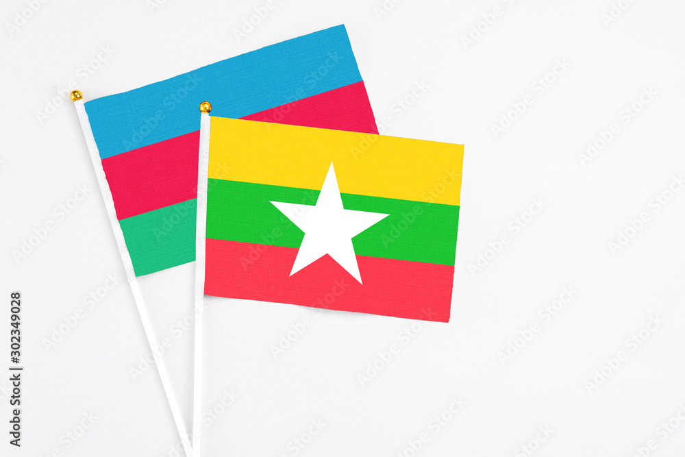 Myanmar and Azerbaijan stick flags on white background. High quality fabric, miniature national flag. Peaceful global concept.White floor for copy space. Myanmar and Azerbaijan stick flags on white background. High quality fabric, miniature national flag. Peaceful global concept.White floor for copy space.