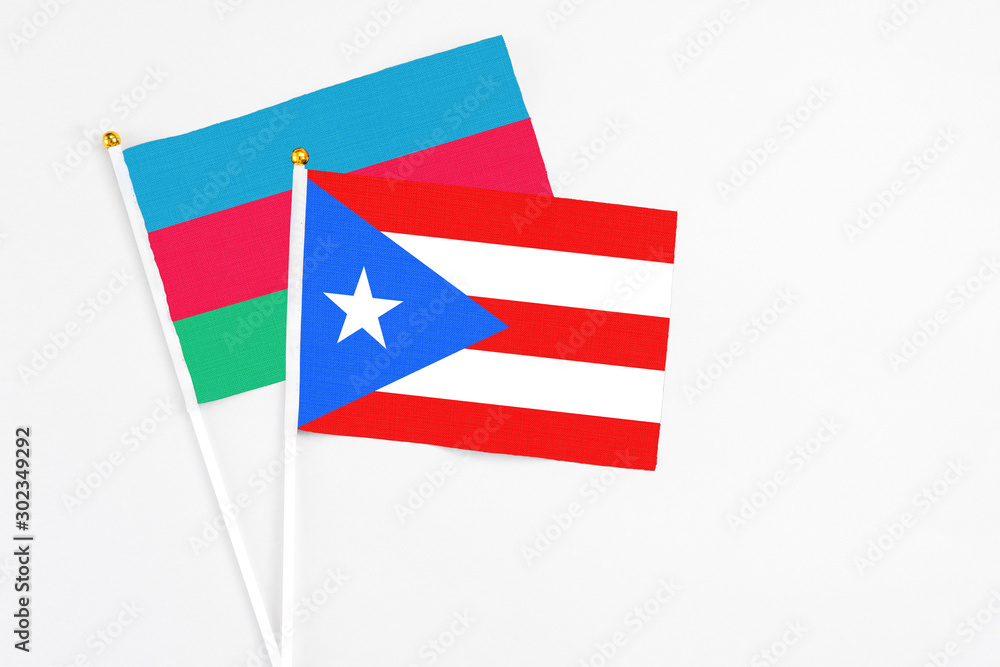 Puerto Rico and Azerbaijan stick flags on white background. High quality fabric, miniature national flag. Peaceful global concept.White floor for copy space. Puerto Rico and Azerbaijan stick flags on white background. High quality fabric, miniature national flag. Peaceful global concept.White floor for copy space.