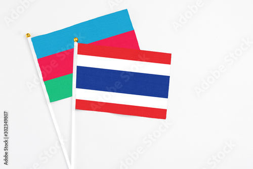 Free Download Thailand and Azerbaijan stick flags on white background. High quality fabric, miniature national flag. Peaceful global concept.White floor for copy space. - GFXLoad